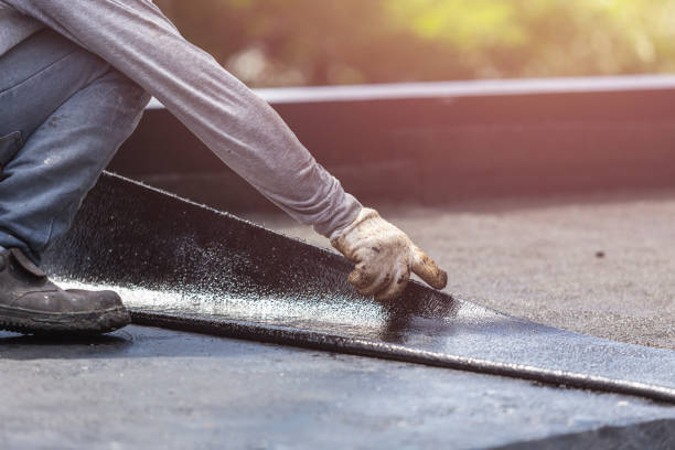 Professional Basement Waterproofing technician working in Corvallis, MT